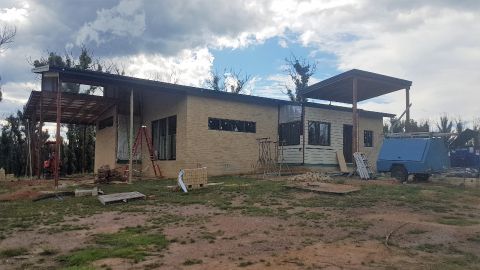 A brick house under construction.