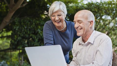 Older couple using laptop