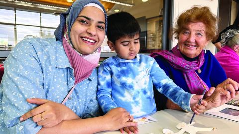 Hazeera, her son Ibrahim, and Eurobodalla local Heather at the library intergenerational playgroup.