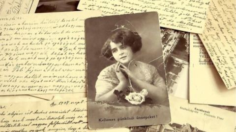 Handwritten letters and an old sepia-toned photograph of a young girl.