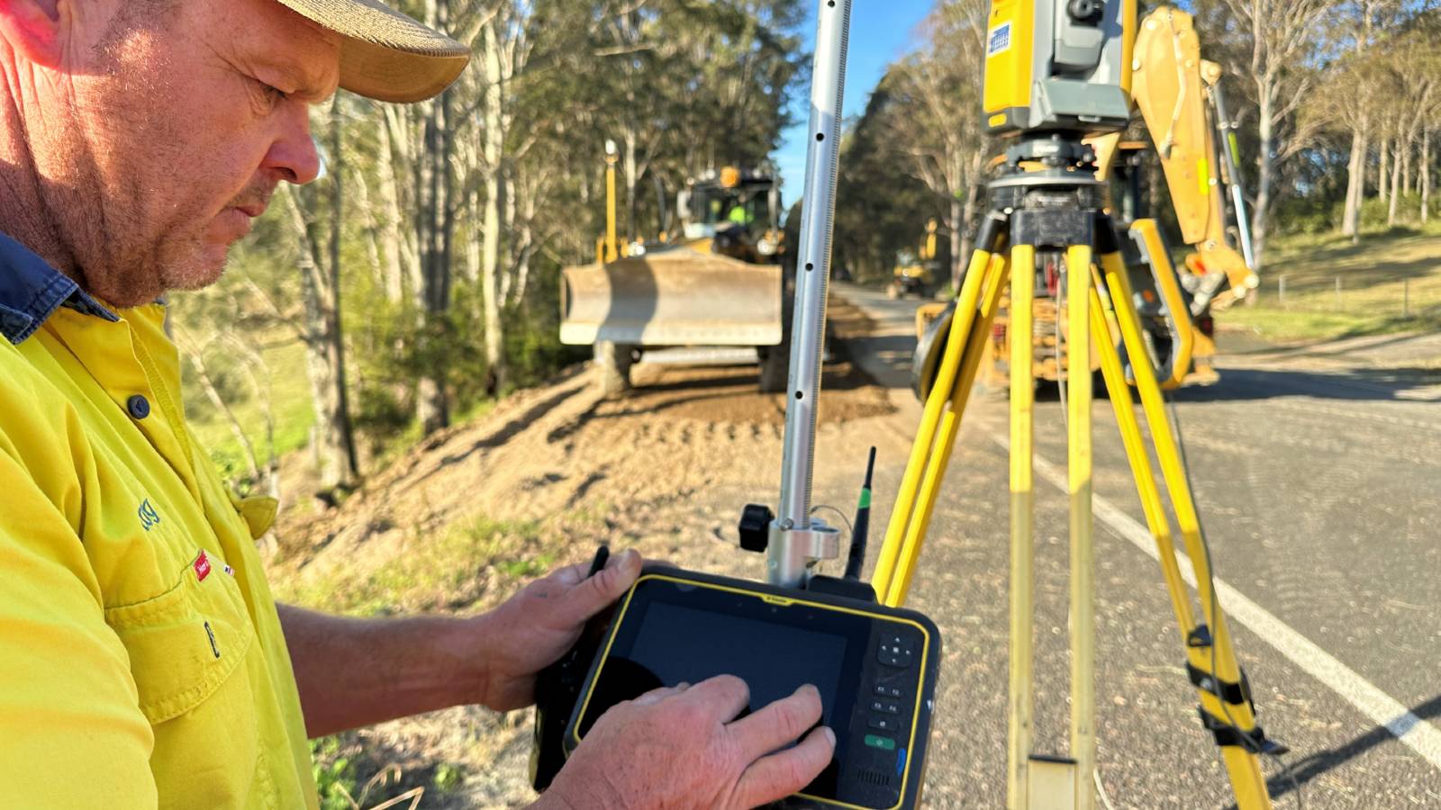 Image A worker operates a digital measuring instrument 