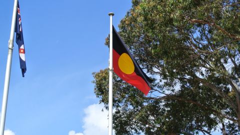 The Aboriginal Flag raised on a flagpole