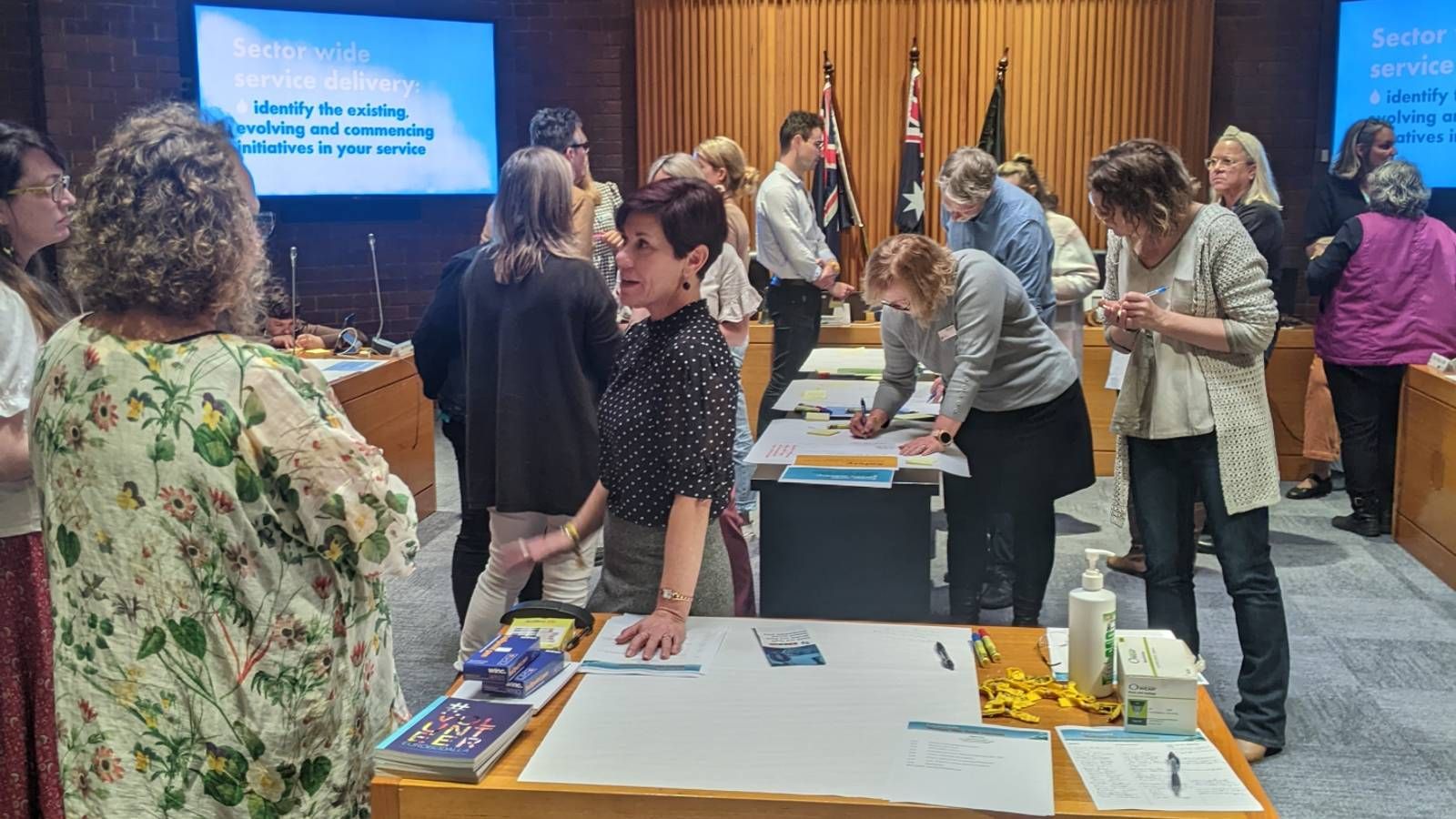 People talking at a networking event held in a room. banner image