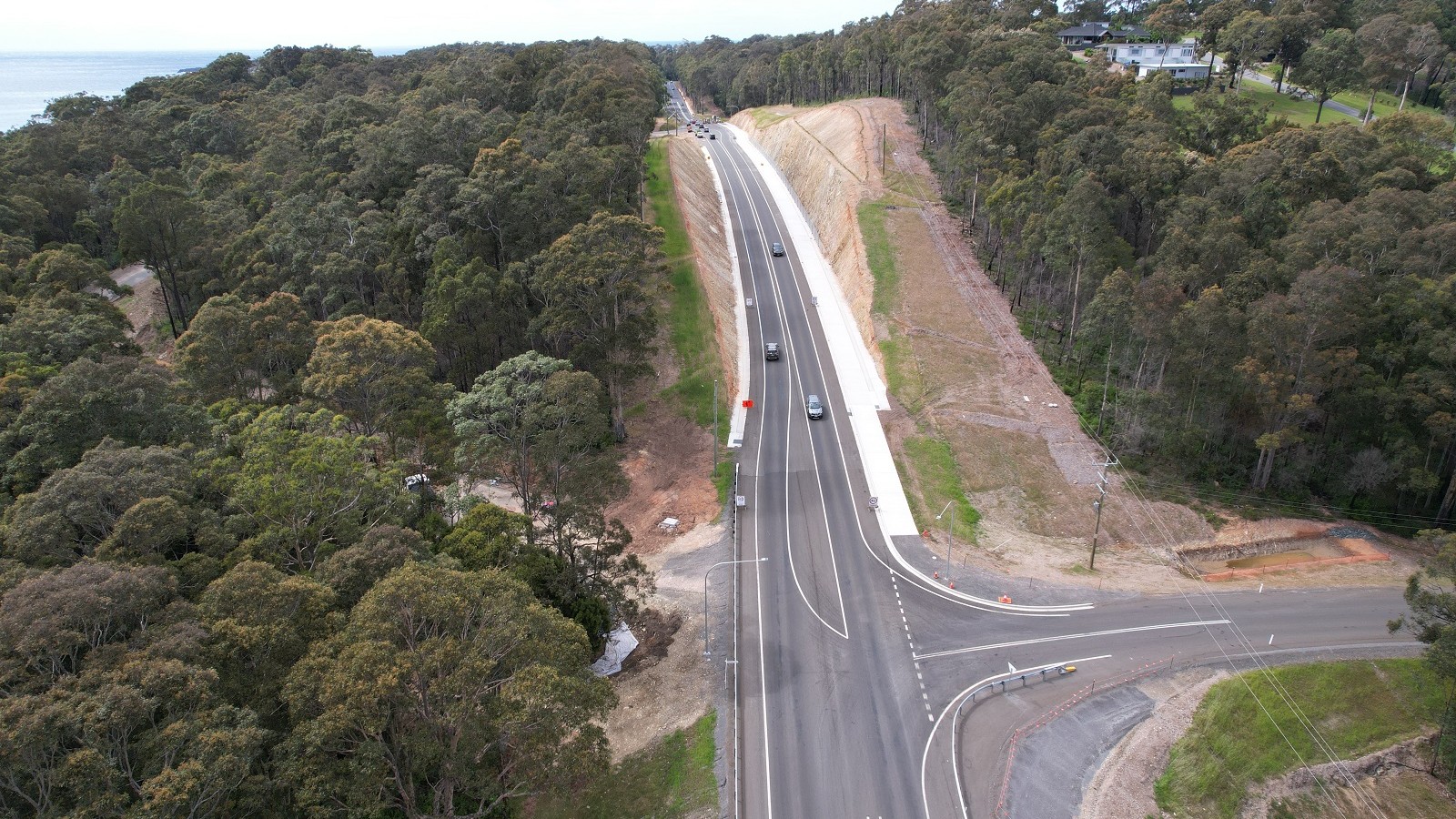 Image A drone photo shows a new straight road through bushland