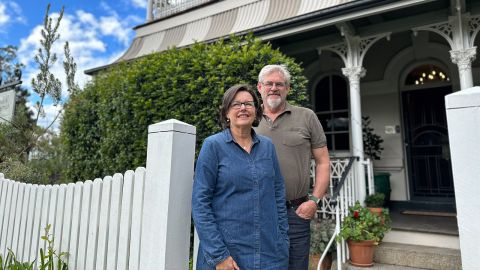 Suellen and Michael Franklin outside their Bed and Breakfast, the heritage Post and Telegraph.