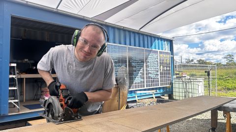 Electrical apprentice Beau Cleary working in the Repurposing for Resilience space at the Moruya  Transfer Station.