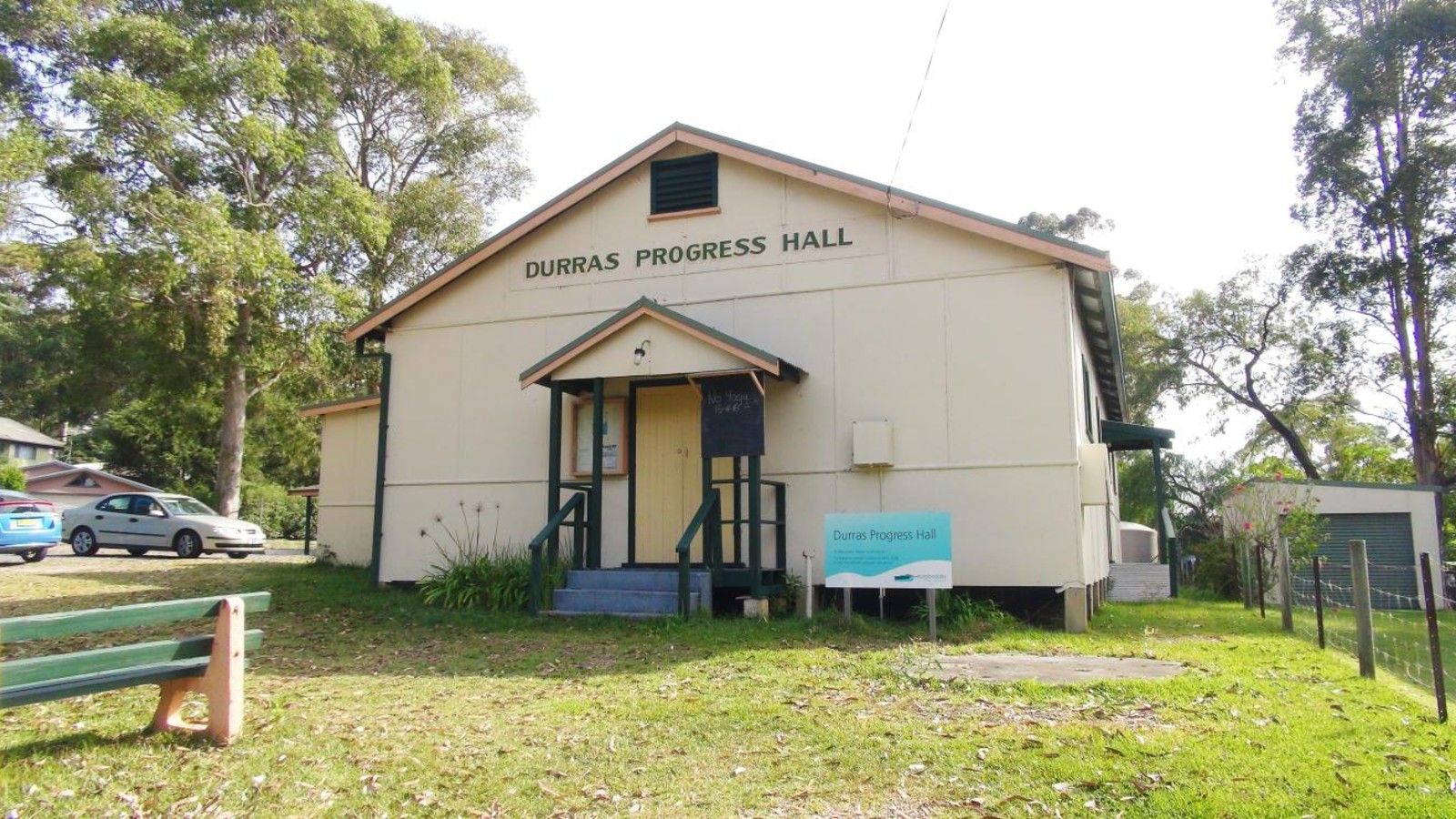 Front entrance of Durras Progress Hall surrounded by trees and open grass. banner image
