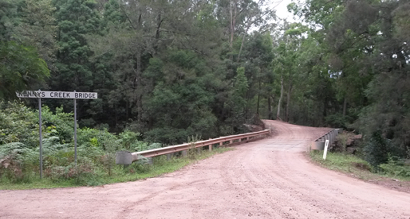 Image The timber bridge sits in a green setting