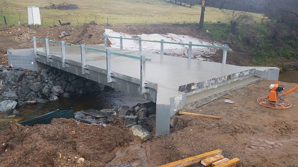 Image Freshly poured concrete forms the new bridge surface