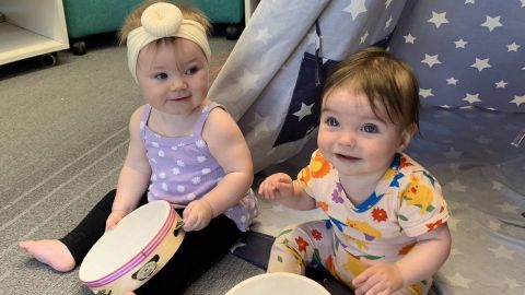 Two children at a library Rhyme time session.