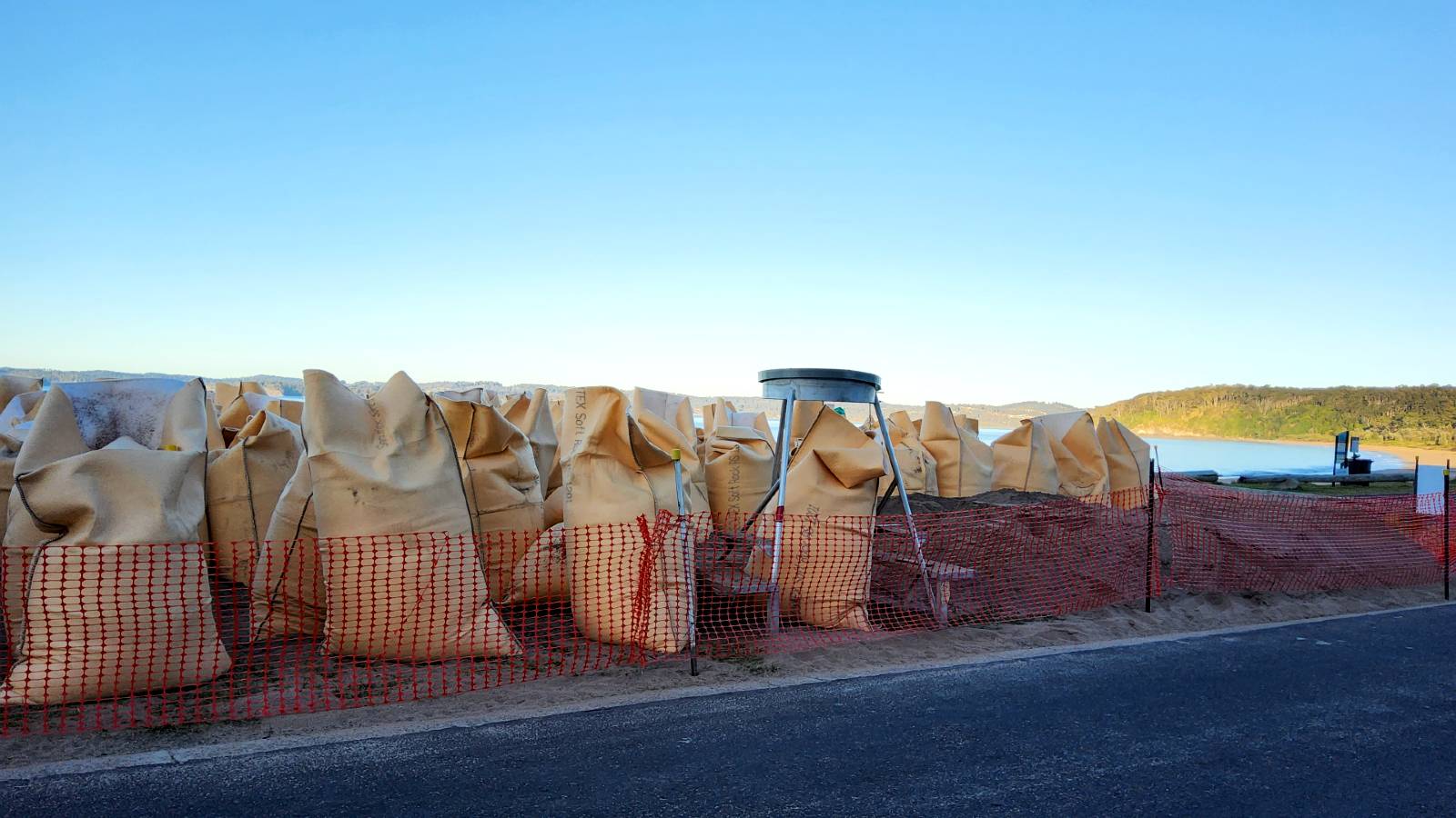 Image Huge sandbags are stacked upright and open at the top.