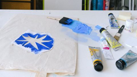 Stencil art painted onto a cloth bag.