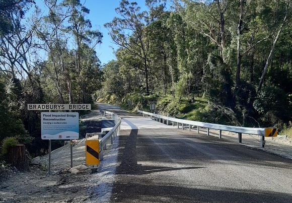 Image Guardrail lines the edges of a new bridge and road surface.