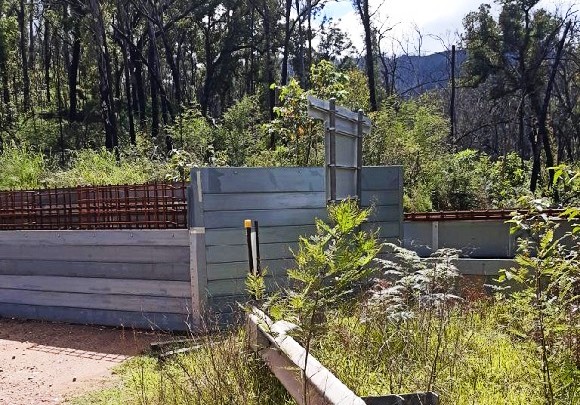 Image A steel structure sits in a bushland setting