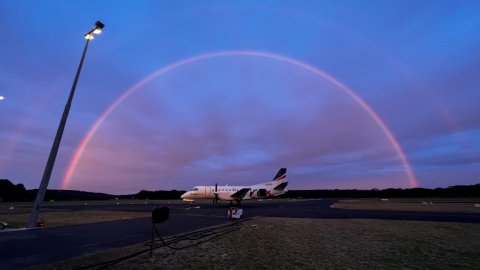 A rainbow over a Rex plate parked at Moruya Airport. 