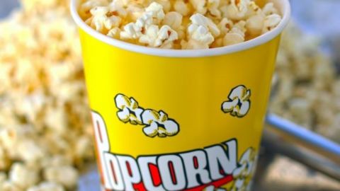 Container of popcorn at the movies ready for sale.