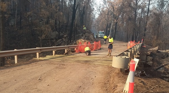 Image Council workers replacing the bridge timbers