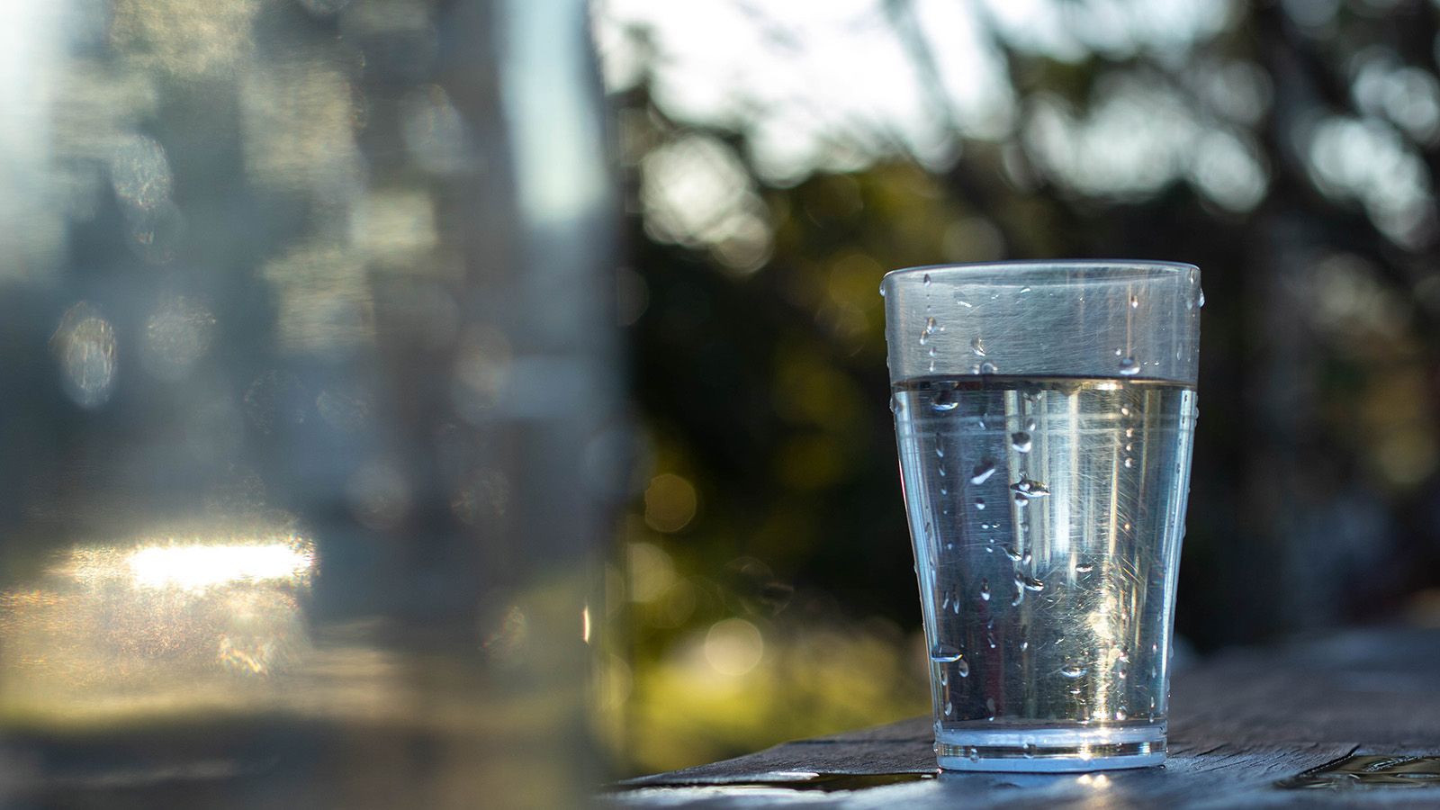 A drinking glass filled with water banner image