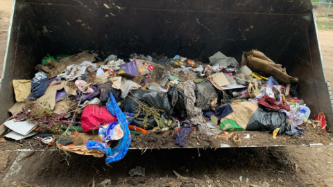 rubbish in the bucket of a loader machine