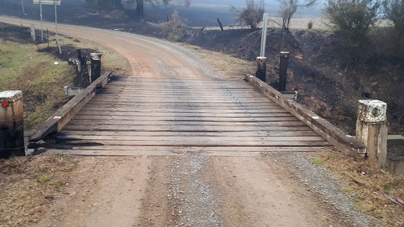 Image The timber bridge has relatively small burnt areas