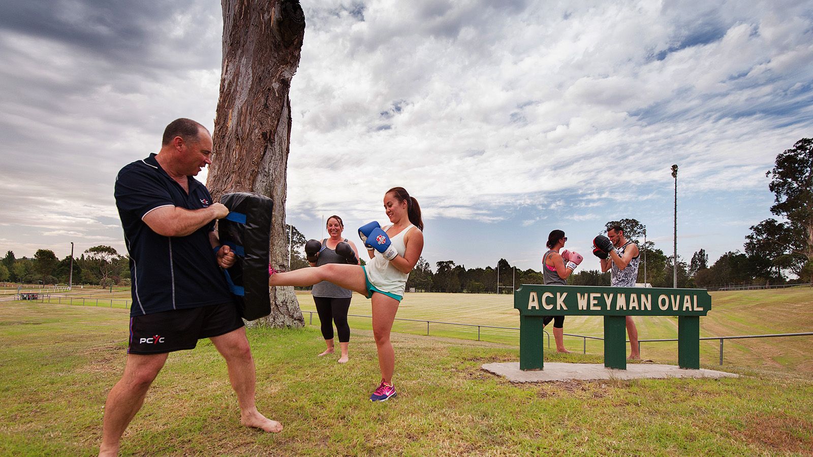 Five people participating in a boxing training session at Moruya's Ack Weyman Oval banner image