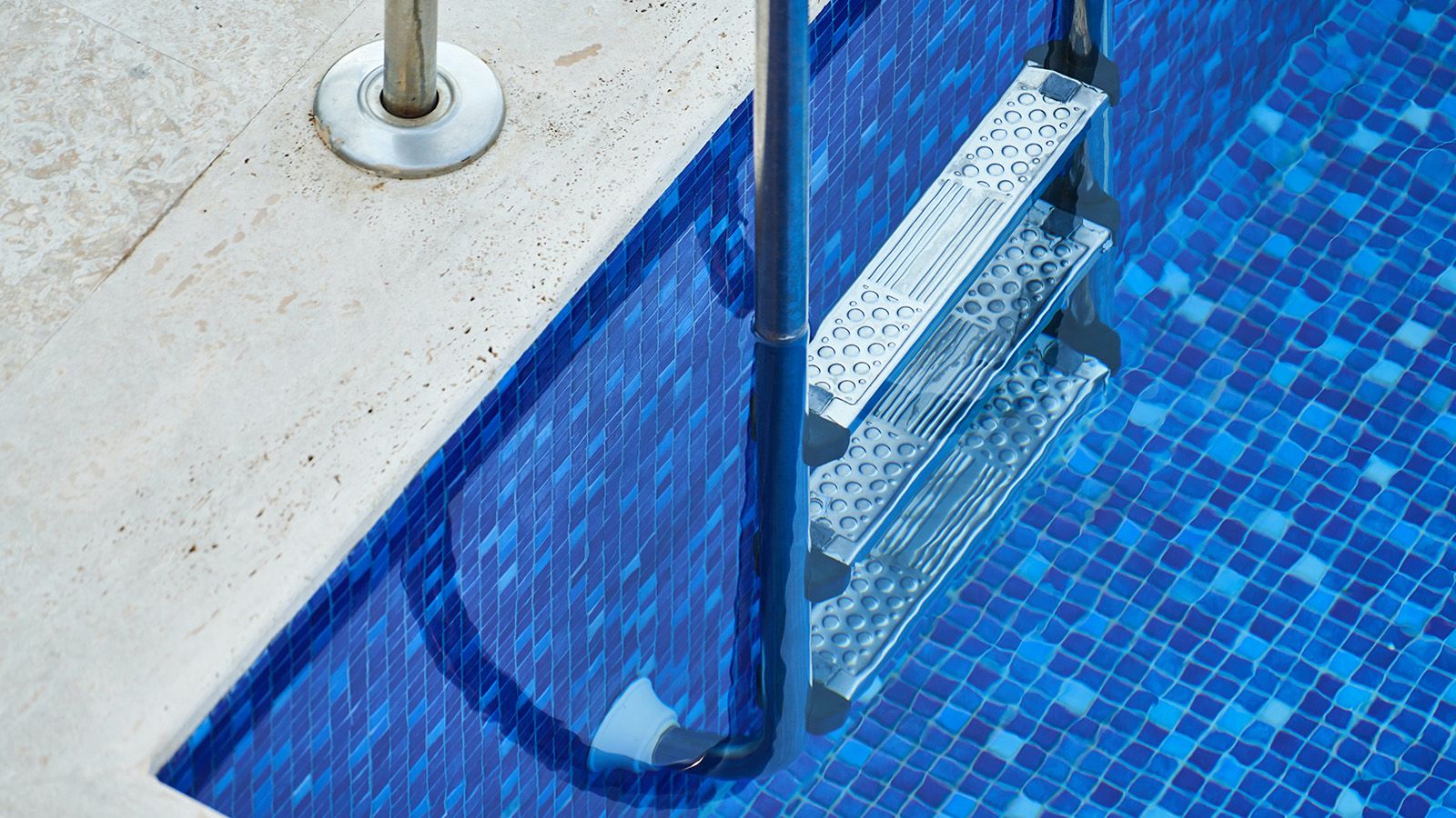 Close cropped photograph of a swimming pool ladder banner image