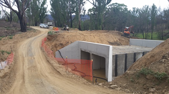 Image Huge concrete box culverts sit next to the temporary side track