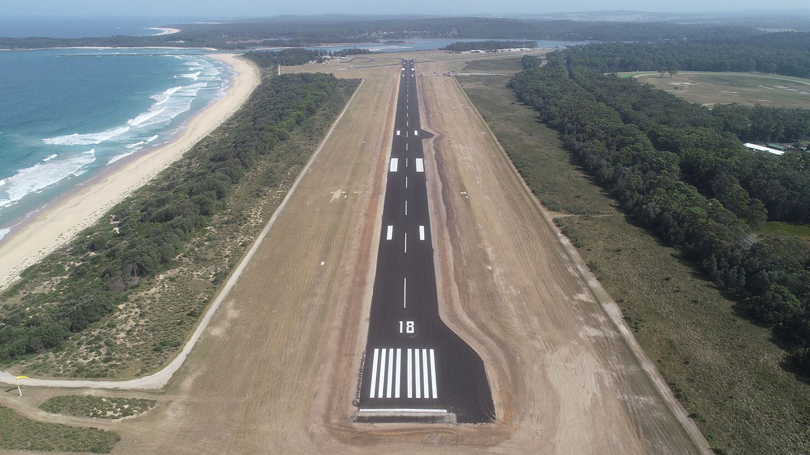 Aerial photograph of Moruya Airport's runway banner image