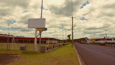 A main road with buildings on either side.