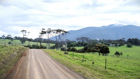 A rural property with rolling hills in the background
