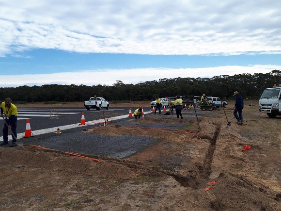 Electric cables are being installed underground.