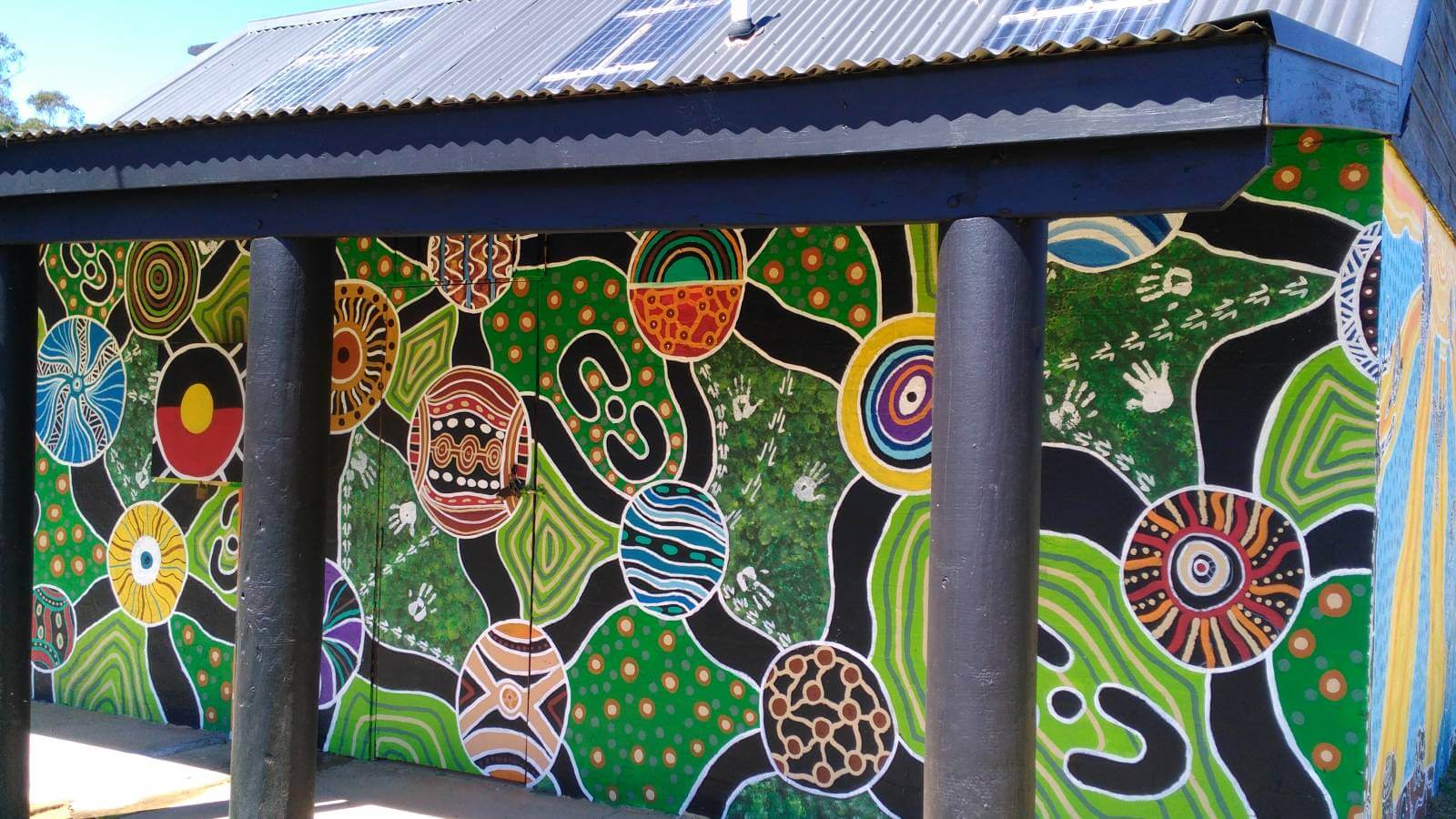 Image Artwork by Aboriginal artist Bronwen Smith featured on the the public toilet building at Mogo Recreation Park