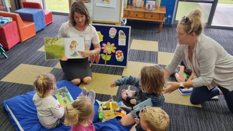 Children and a parent at library Storytime session