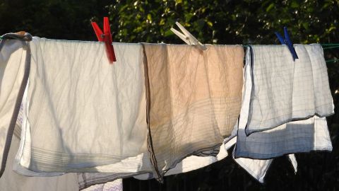 Close up image of linen items hanging on a clothesline 