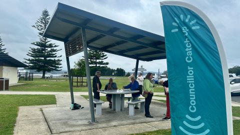A group of people at a park table
