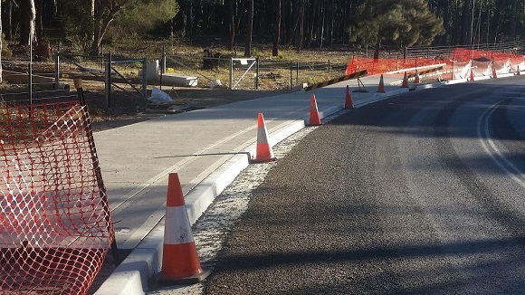 Looking west.  Note separation provided by kerb and gutter - without it, extensive land acquisition would have been required