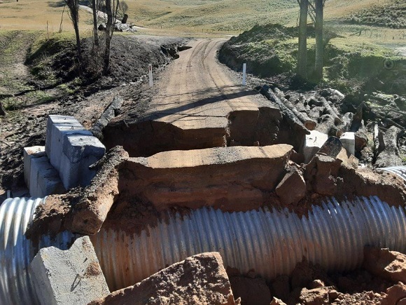 Image FLood waters have washed away large sections of the temporary crossing 