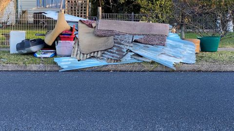 Junk waste piled up at a residential kerbside
