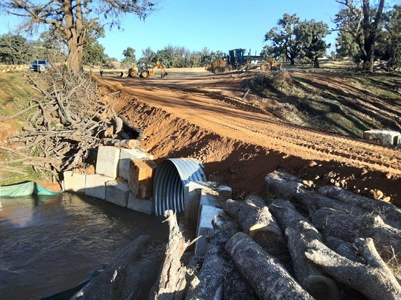 Image Blocks and logs support material laid to form a creek crossing