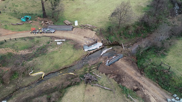 Image A drone photo shows construction on both sides of the creek