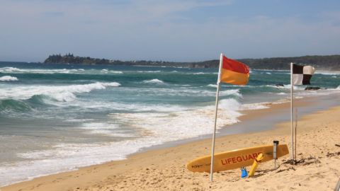Red and yellow lifeguard flags at Tuross Beach