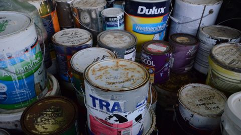 a bunch of paint tins