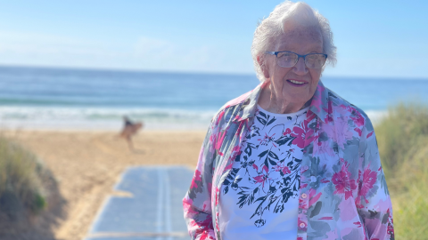 Elderly woman on the beach 